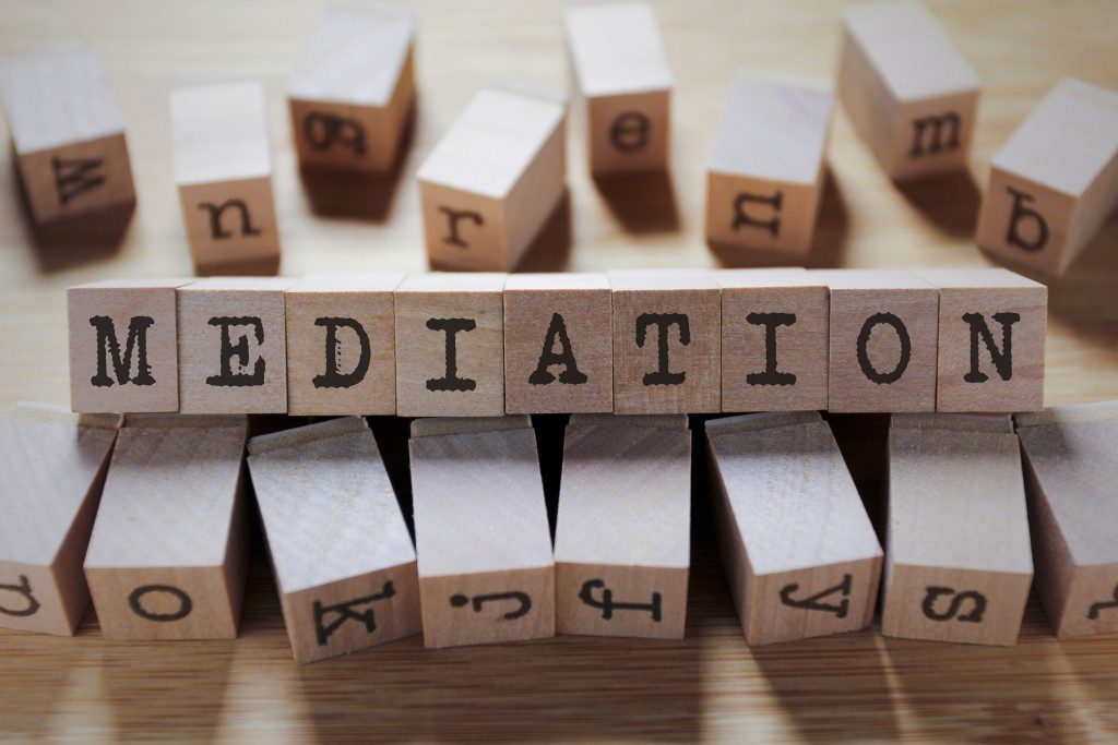 wooden cubes spelling out mediation