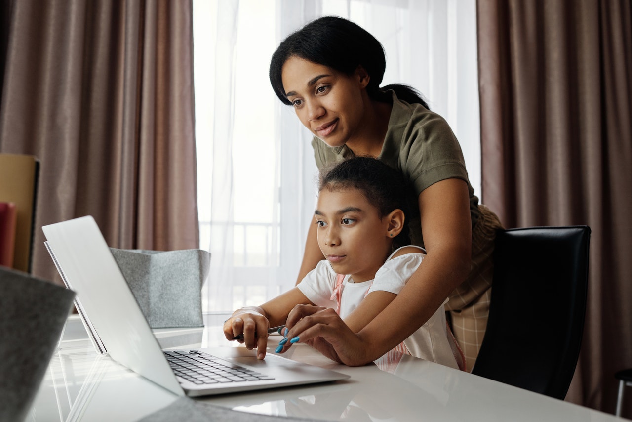 mother and daughter using a laptop