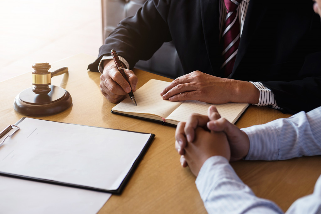 A man talking to a lawyer in an office