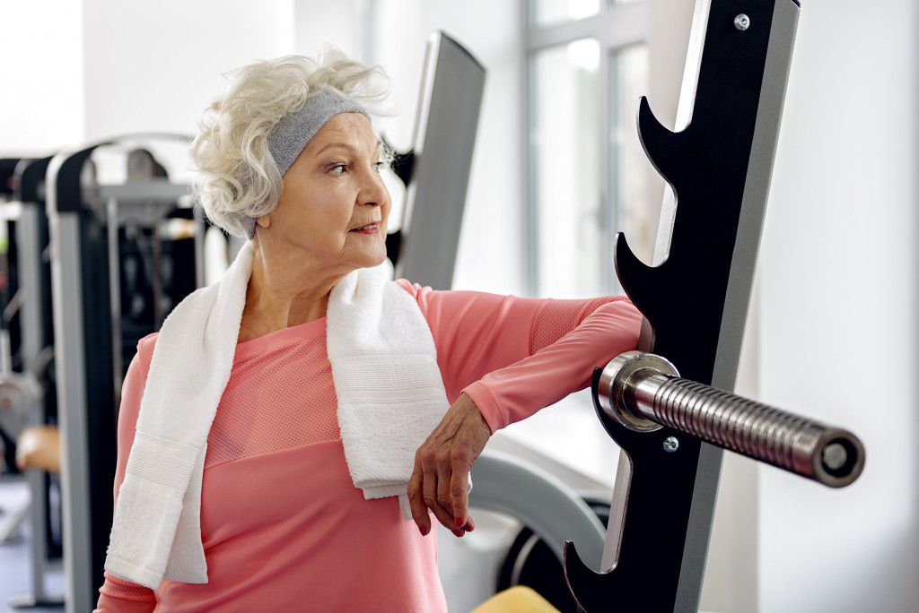 a fit senior woman at the gym