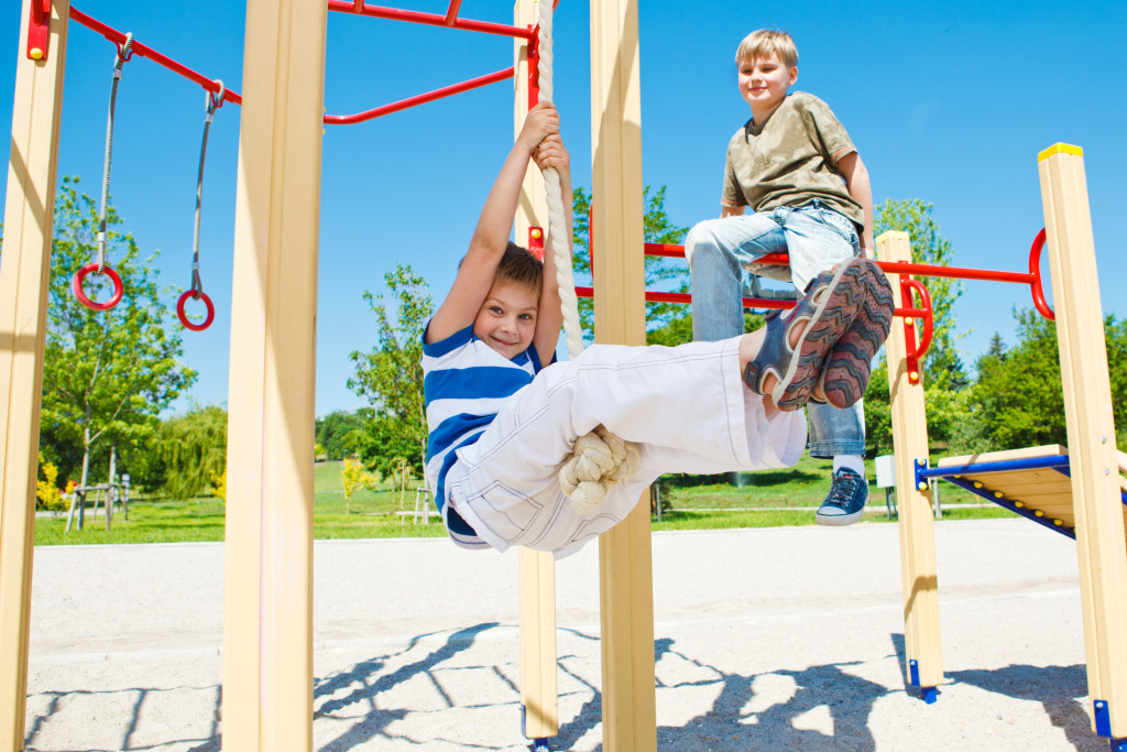 children swinging on rope