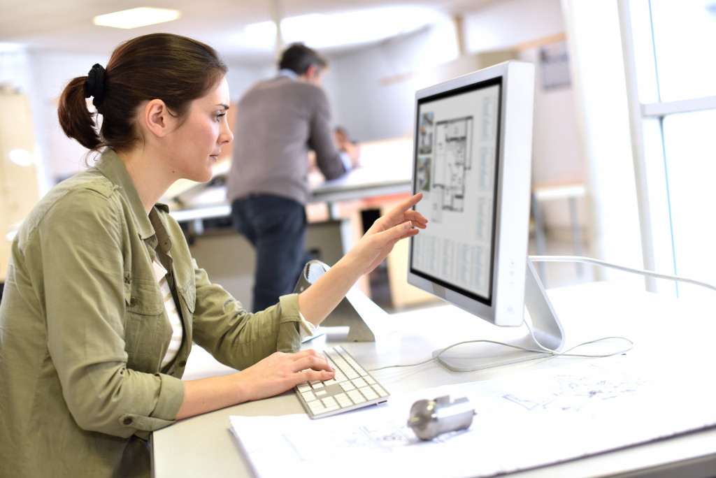 woman studying architecture using a computer