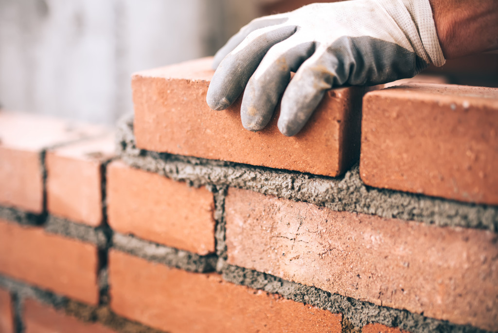 A worker doing brickwork