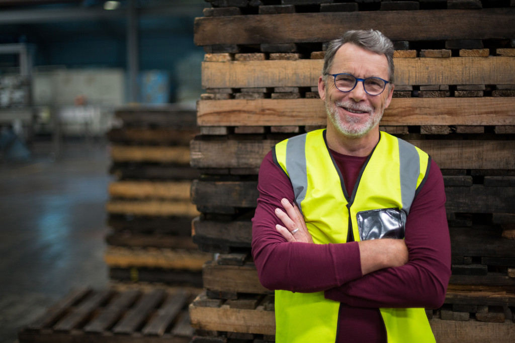 male factory worker with hands crossed