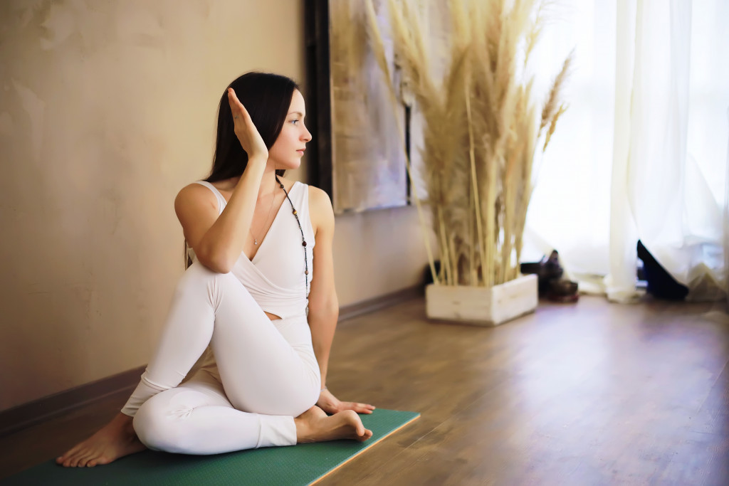 A woman doing yoga at home