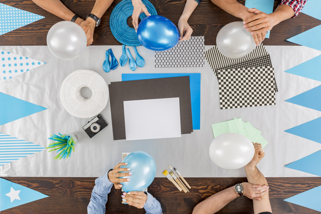 group of people planning and preparing for a party