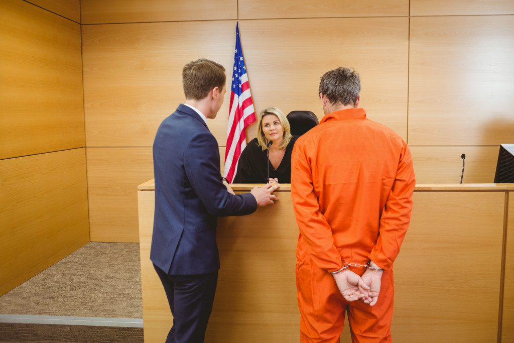 criminal in handcuffs in the court room